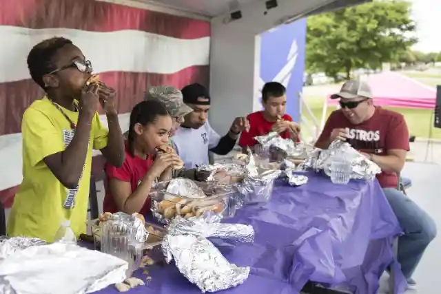 Being Super Thrilled To Win A Hot Dog Eating Contest 