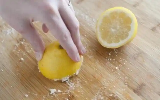 Sprinkling Baking Soda For Steel Sinks